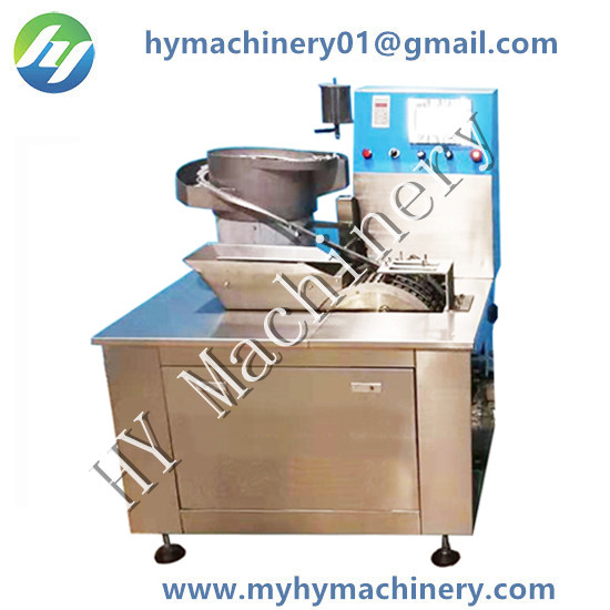 Automatic suction-saliva  tube and tip capping combination machine