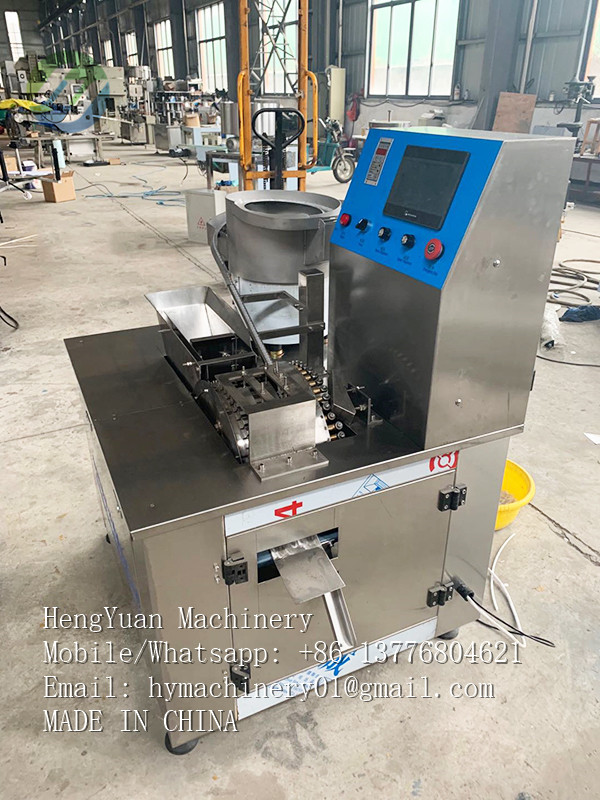 Automatic saliva suction tube and lid combination machine